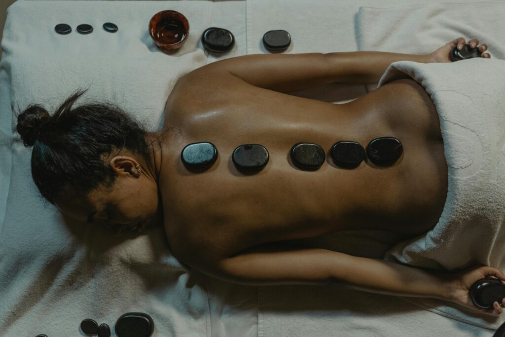 Woman receiving a massage on a table.